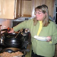 Ellen tasting traditional food from Botswana